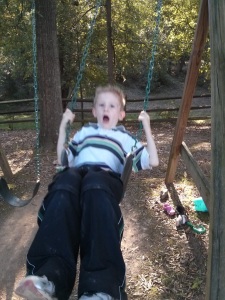 Bryon on the back yard swing