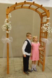 Bryon and Elizabeth at the wedding arch