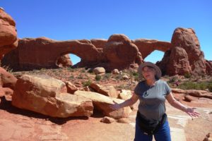 Danita discusses "husbands" with another guest in front of the double arch