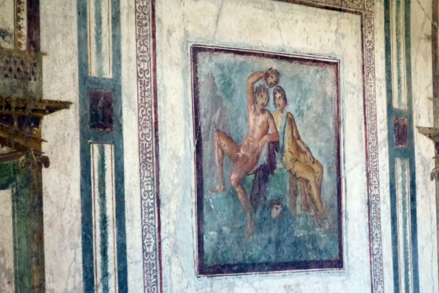 A scene of Perseus and Andromeda. Perseus holds the severed head of Medusa.