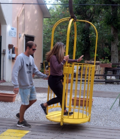 The cable ride is in open baskets, 2 people to a basket. Here Suzy is getting on. Danita told me she had no desire to open the door and dangle her feet over the edge. Then she informed me that  I didn't either ;-)